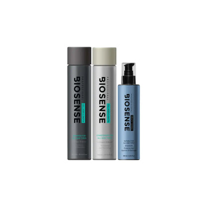 Three bottles of Biosense hair care products in gray, beige, and blue colors.