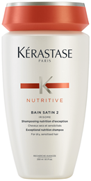 White plastic bottle with an orange cap labeled Kérastase Nutritive Irisome Bain Satin 2 Shampoo.