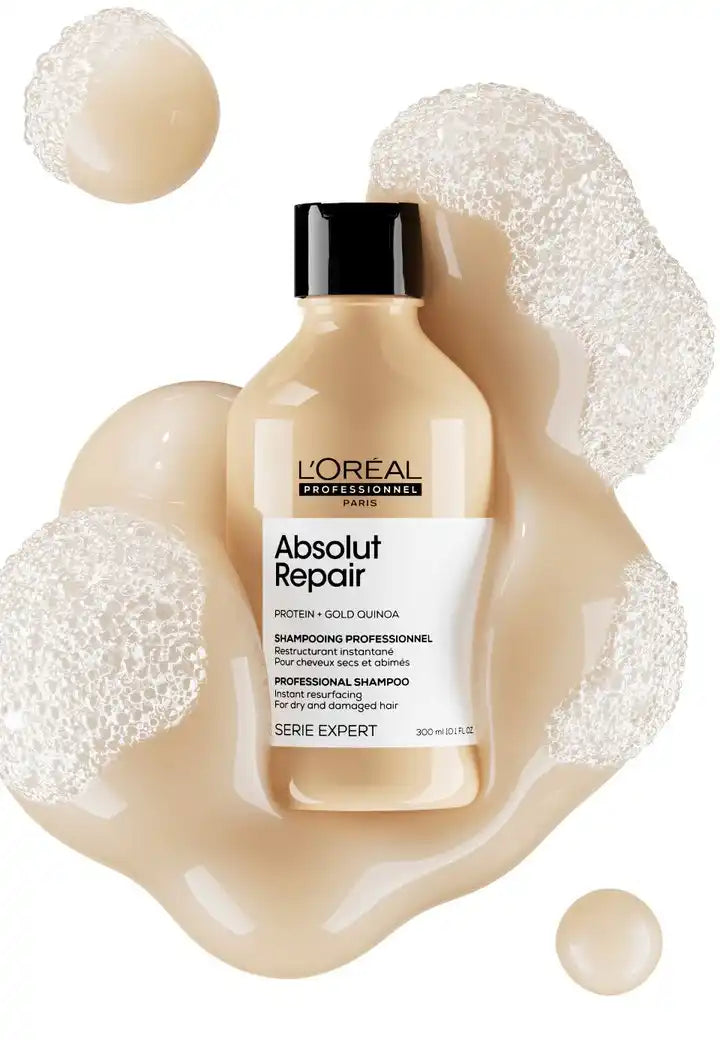 Bottle of L’Oreal Absolut Repair shampoo or hair product.