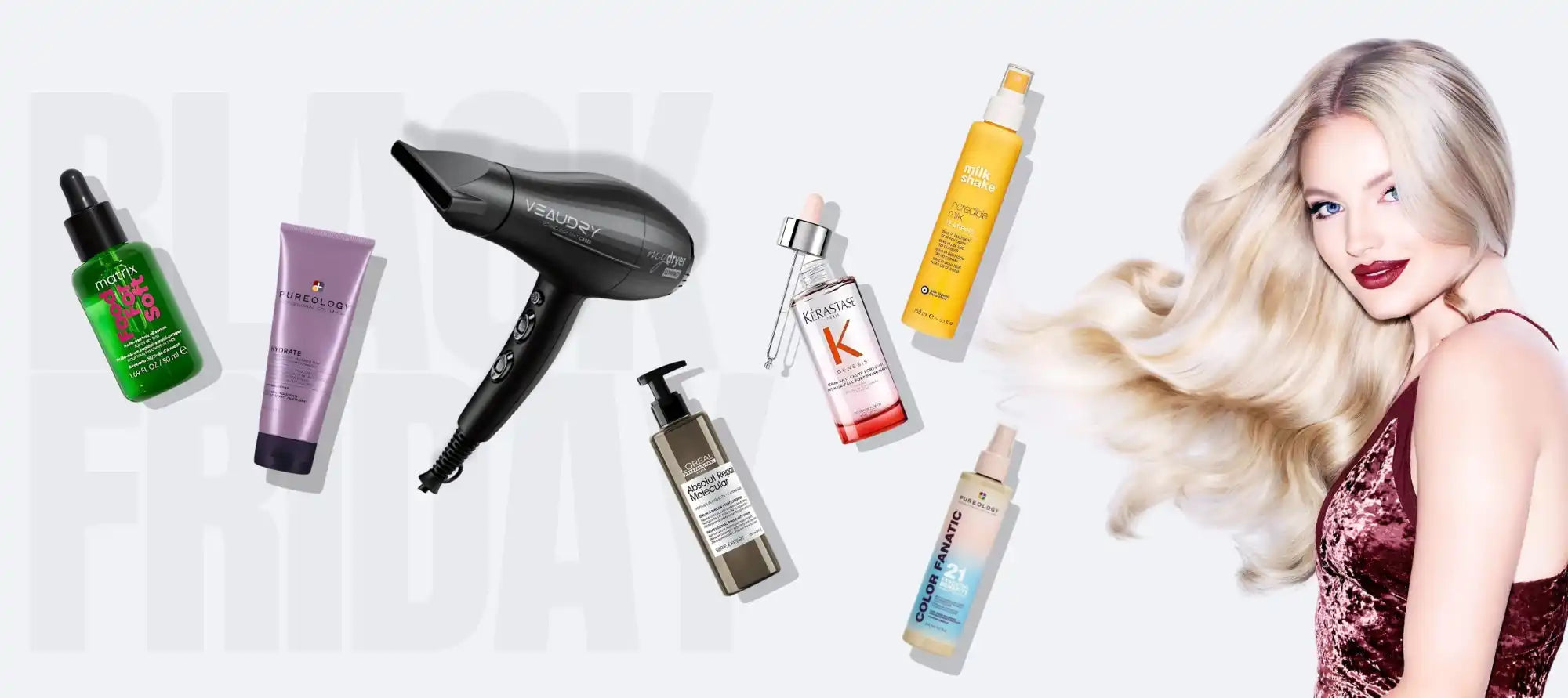 Collection of hair care products and styling tools alongside a woman with flowing blonde hair.