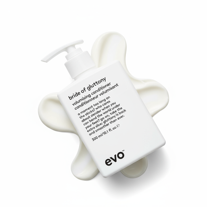 EVO Bride of Gluttony Volumising Conditioner bottle with creamy white conditioner spread beneath