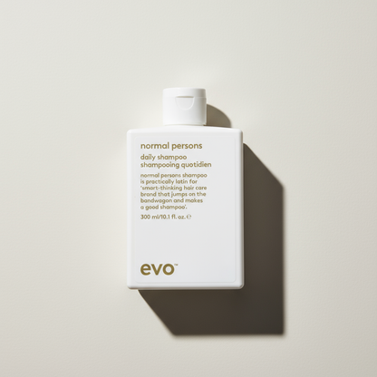 EVO Normal Persons Daily Shampoo white bottle with gold text for everyday hair care