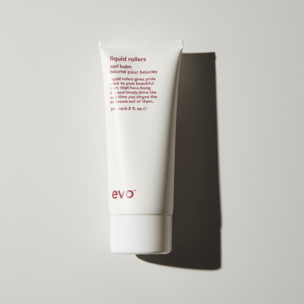 Evo Liquid Rollers Curl Defining Balm in white tube with red text for defining curls