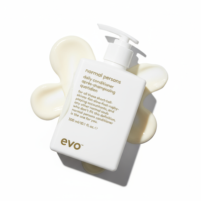 EVO Normal Persons Daily Conditioner bottle with creamy conditioner swatch on white background