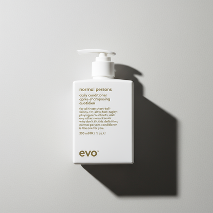EVO Normal Persons Daily Conditioner in white pump bottle for everyday hair care