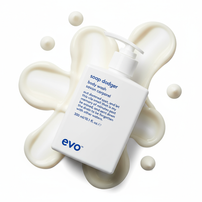 EVO Soap Dodger Nourishing Body Wash bottle with creamy body wash splash background