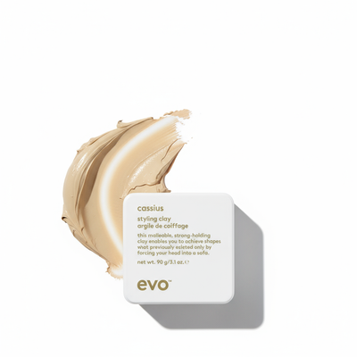 EVO cassius styling clay strong hold hair clay for men in white square container with beige clay swatch