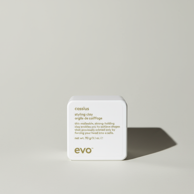 EVO Cassius strong hold hair clay for men in a white square container with gold text