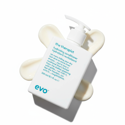 EVO the Therapist Hydrating Conditioner white pump bottle with cream swirls on white background