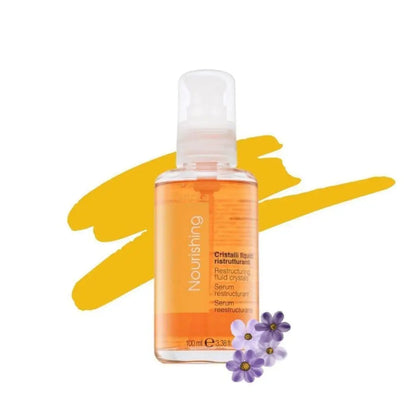 Orange-colored liquid skincare product in a clear bottle with a pump dispenser.