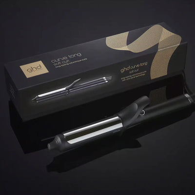 GHD Curve Soft Curl Tong: Professional Curling Iron for Soft, Voluminous Curls & Waves. GHD curling iron shown with box.