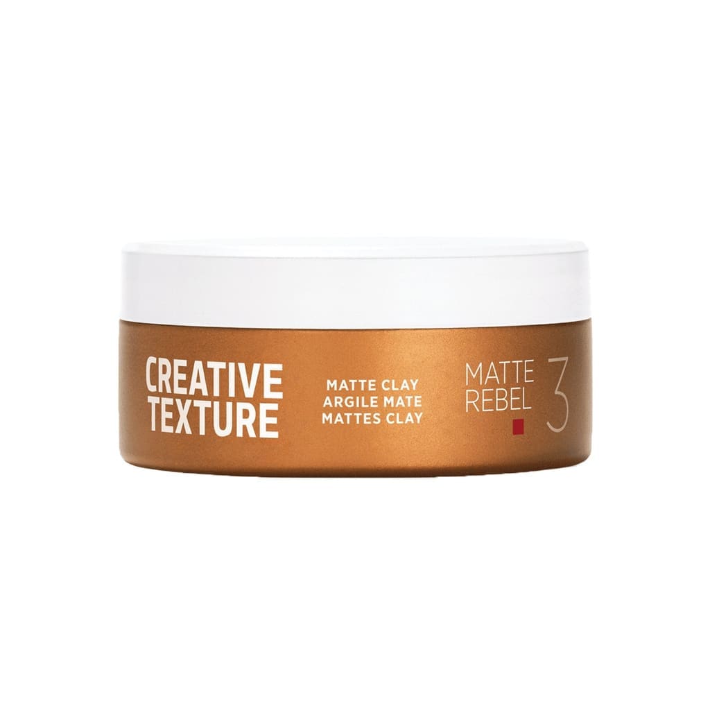 Hair styling product container labeled ’Creative Texture Matte Clay’ in brown and white colors.