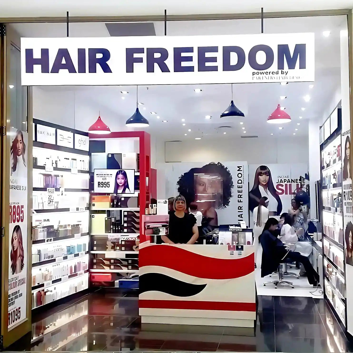 Hair Freedom retail store front with signage and hair product displays.