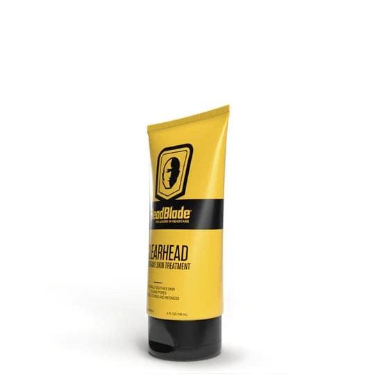 Yellow tube of HeadBlade Headliner hair treatment displayed in Headblade Clearhead Bump treatment