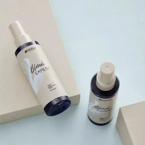 Indola Blonde Expert Insta Cool Spray: Hair care for vibrant, blonde hair. Neutralizes yellow tones, achieving salon-worthy results at home.