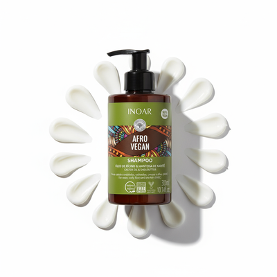 Inoar afro vegan shampoo for curls bottle with cream swirls on white background