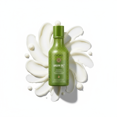 Inoar argan moisturizing shampoo green bottle with creamy white product background