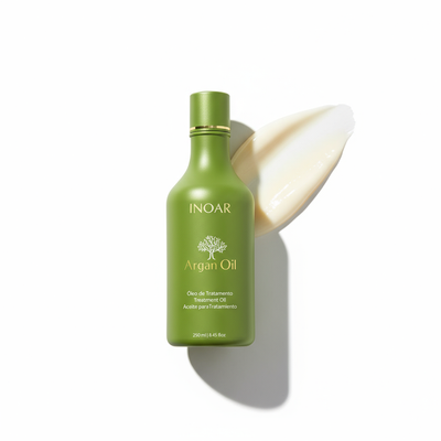 Inoar argan oil conditioner for dry hair in green bottle with creamy texture on white background