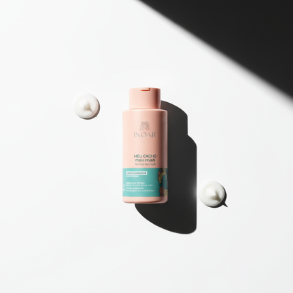 Inoar My Curl My Crush Conditioner bottle with cream droplets on white background