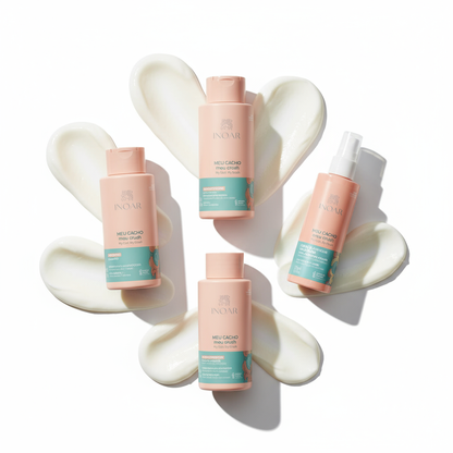 Inoar My Curl My Crush styling bundle with four peach and teal hair care bottles on white cream swirls