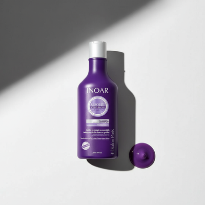 Inoar violet toning shampoo for blonde hair in a purple bottle with a white cap on a white background