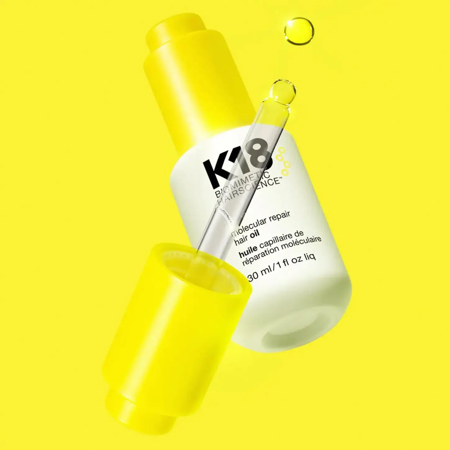 K18 Molecular Repair Oil 30ml revitalizes hair by restoring damaged bonds for healthier, stronger locks.