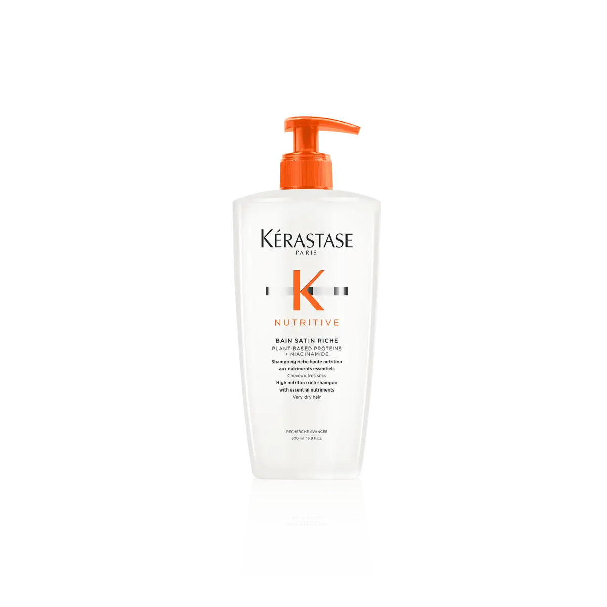 White Kérastase Bain Satin Riche conditioner bottle with orange pump for hair care