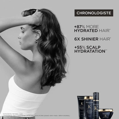 Woman with wavy dark hair using Kerastase Chronologiste Bain Regenerant Shampoo