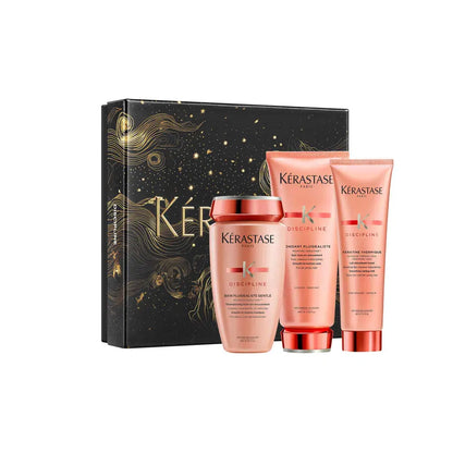 Gift set of Kérastase hair care products in pink packaging.