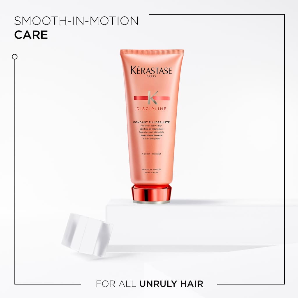 Peach-colored Kérastase Discipline Sulphate Free Trio hair care product tube