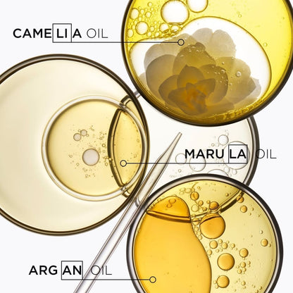 Petri dishes of camellia, marula, and argan oils for Kerastase Elixir Ultime Le Fondant