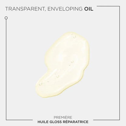 A pale yellow oil droplet in the Kérastase Première Huile Gloss Réparatrice 30ml