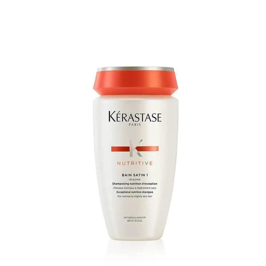 Bottle of Kérastase Nutritive Bain Satin 1 shampoo for slightly dry hair with an orange cap