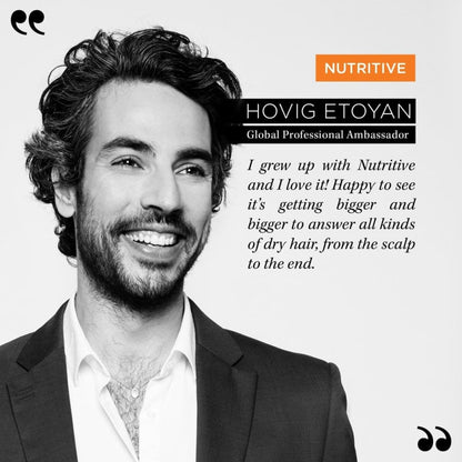 Man with curly hair and beard in suit jacket endorses Kerastase Nutritive Masquintense Riche