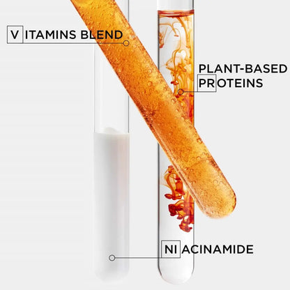 Glass test tube with colored liquids, labeled nutrients for Kerastase Nutritive Nectar Thermique