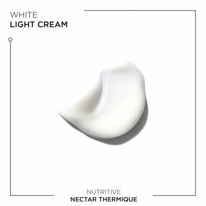 A swirl of white cream showing the texture of Kerastase Nutritive Nectar Thermique