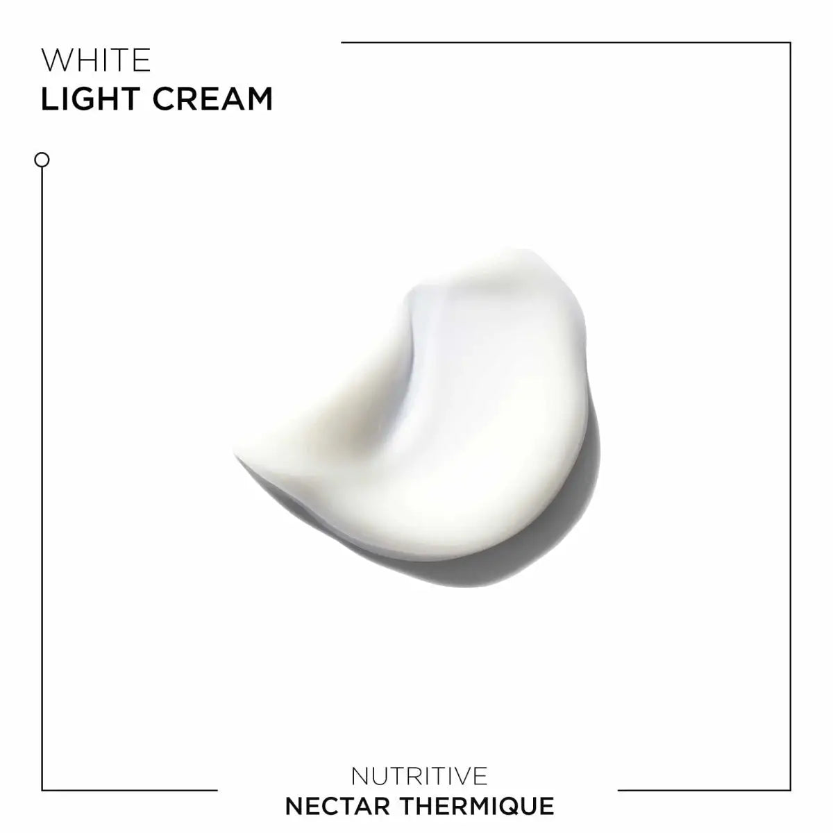 A swirl of white cream showing the texture of Kerastase Nutritive Nectar Thermique