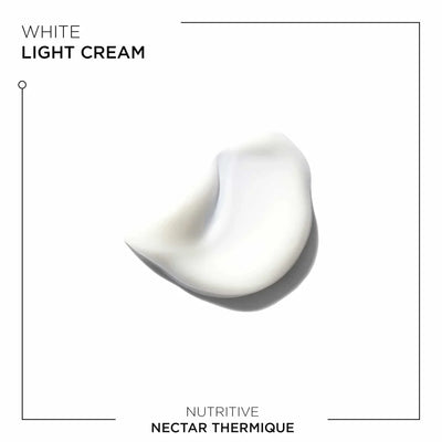 A swirl of white cream showing the texture of Kerastase Nutritive Nectar Thermique