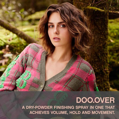 Woman with voluminous, textured hair wearing a stylish cardigan. Doo.Over hairspray advert.