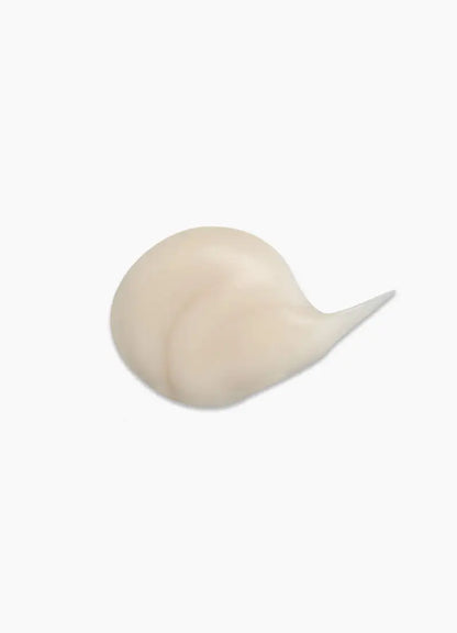 Cream-colored spiral seashell featured with Kevin Murphy Hydrate.Me.Rinse smoothing conditioner