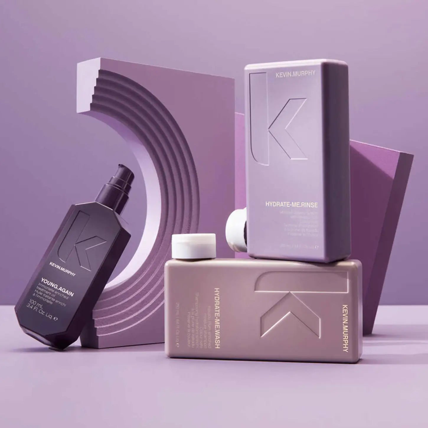 Collection of Kevin Murphy hair care products in purple and mauve packaging.