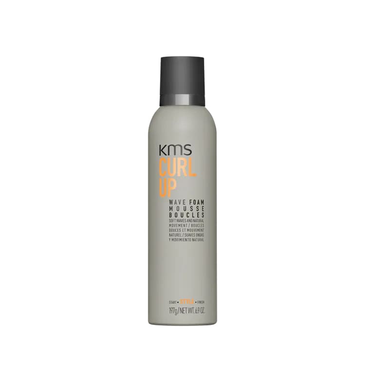 Hair styling product in a gray aerosol can labeled ’KMS HAIR PLAY’.