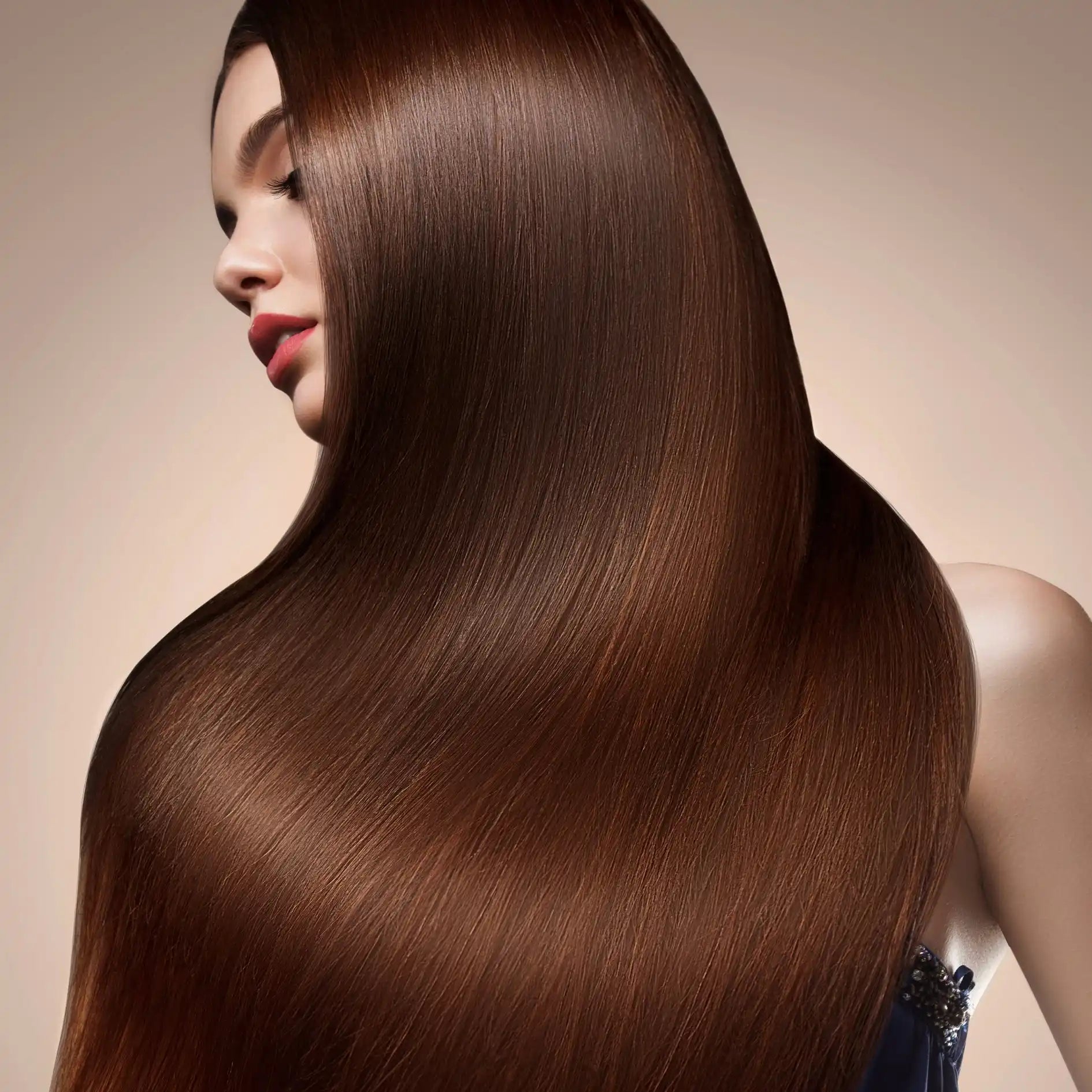 Long, sleek, shiny brown hair cascading down in a smooth curtain.