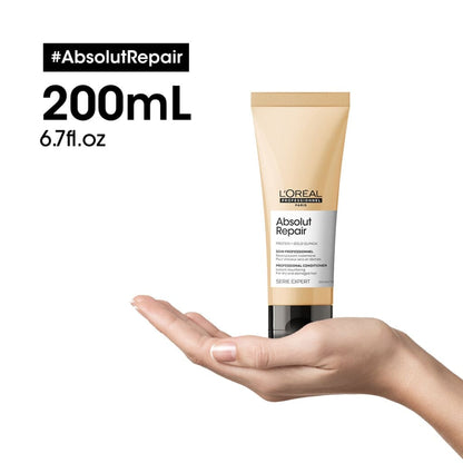 L’Oreal Professionnel Absolut Repair conditioner tube held in an open palm for metal detox