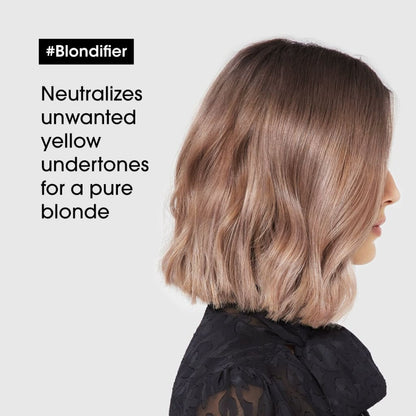 Woman with shoulder-length blonde bob styled using L’Oréal Professionnel Blondifier Conditioner