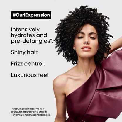 Woman with curly hair in a burgundy top promoting L’Oréal Curl Expression Intensive Moisturizer