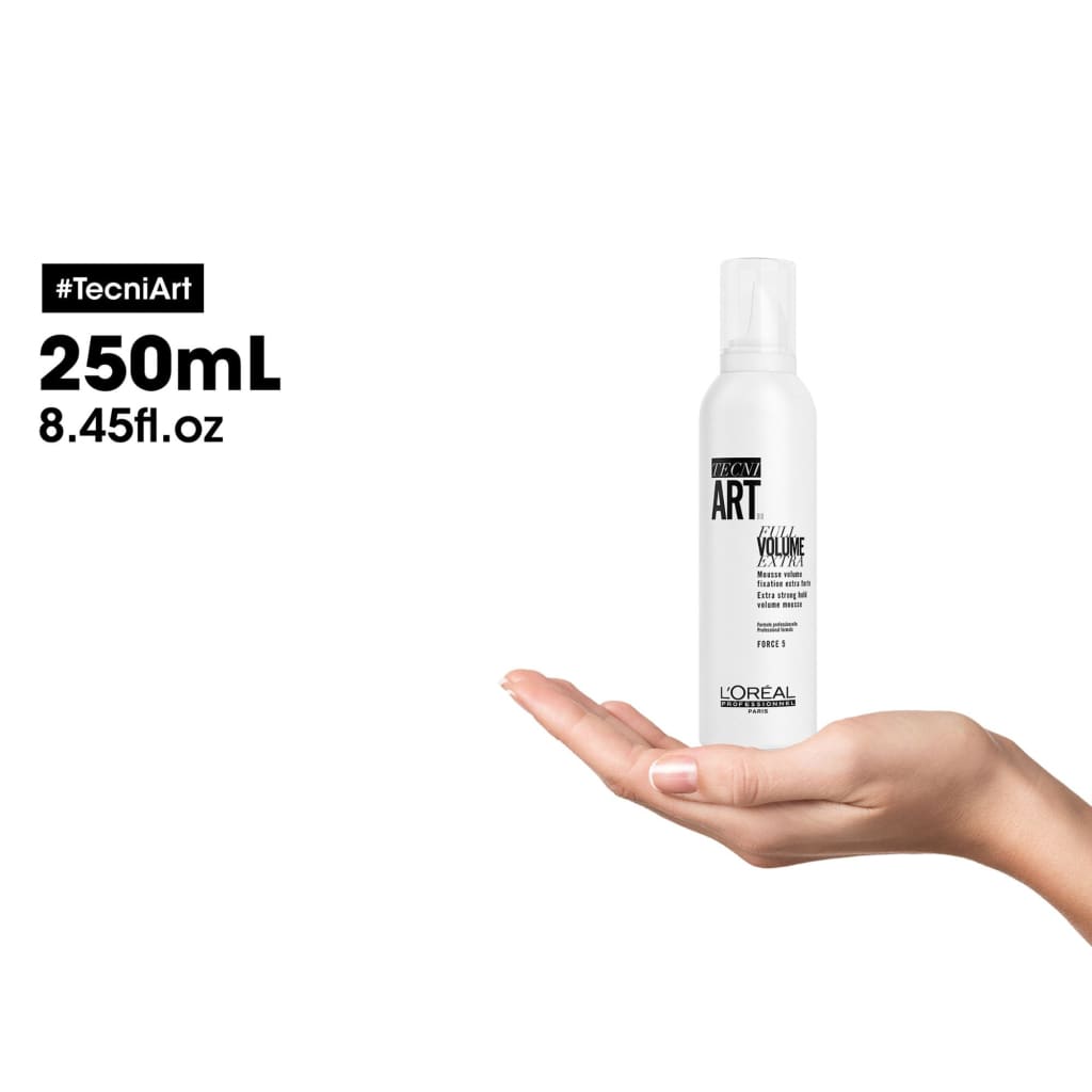 L’Oreal Tecni Art Volume Mousse Extra Strong Hold - 200ML in an outstretched hand