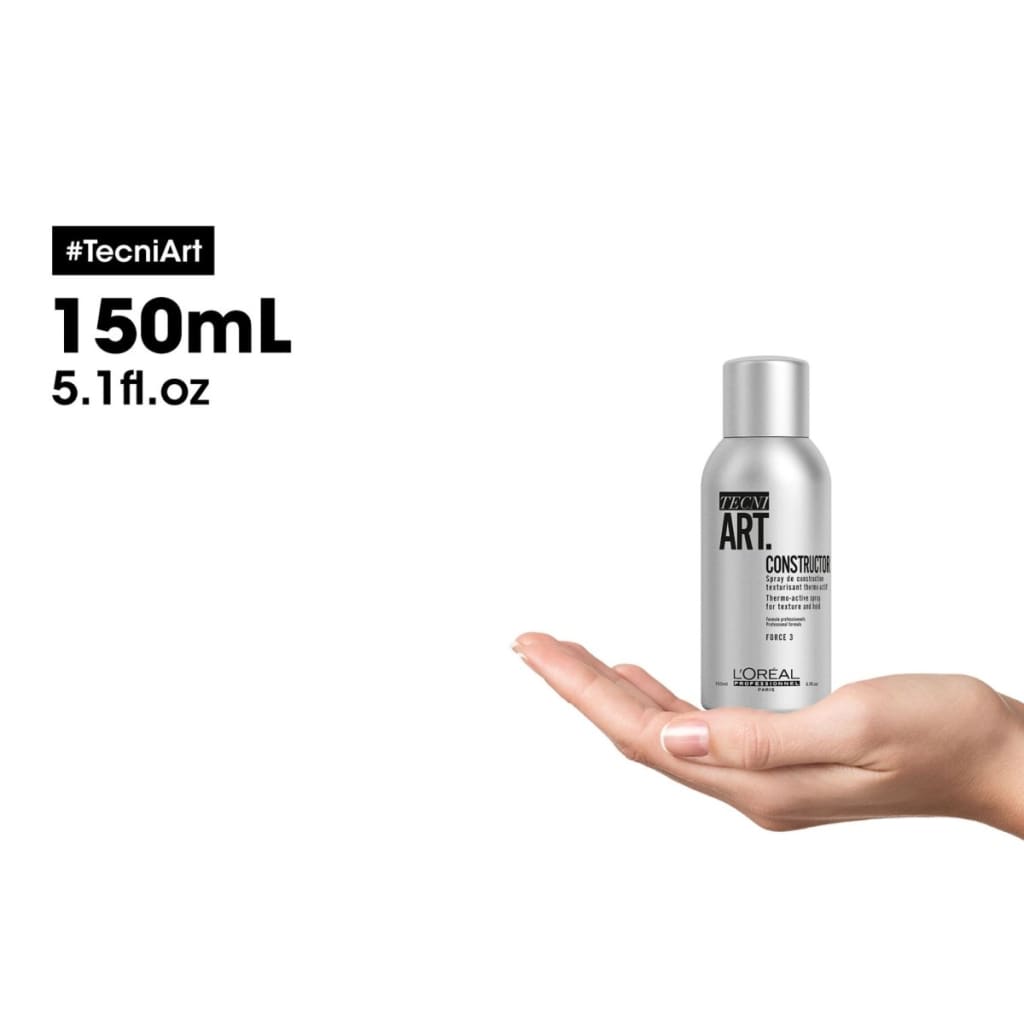 Silver aerosol spray can of L’Oréal Tecni Art Constructor in hand for l’oréal professionnel use