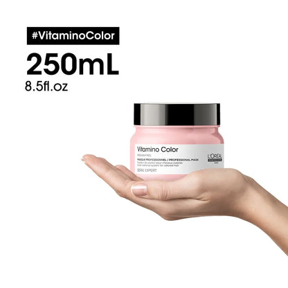 Pink jar of L’Oréal Vitamino Color hair mask in hand - L’Oréal Professionnel product