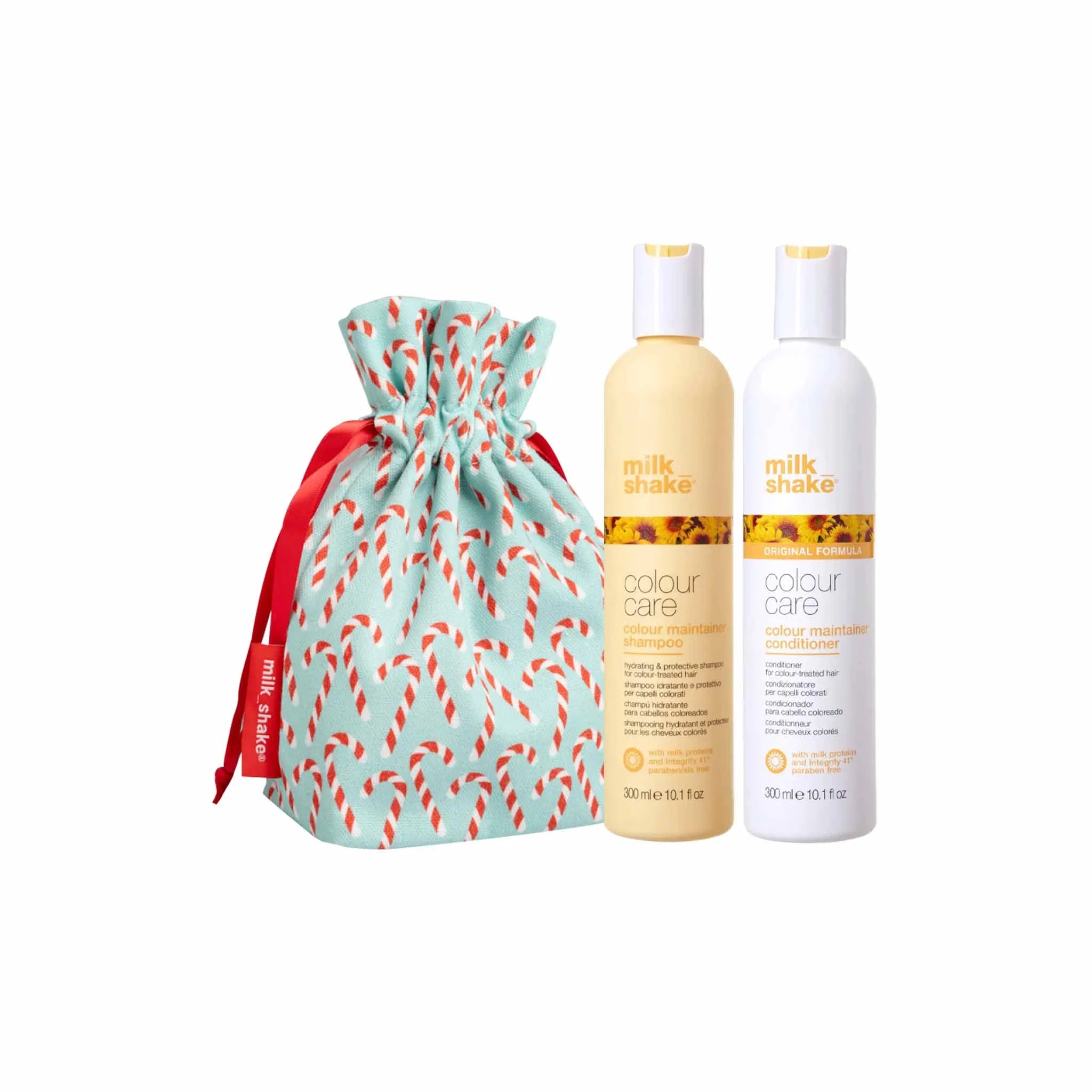 Holiday-themed gift set featuring hair care products and a festive drawstring bag.